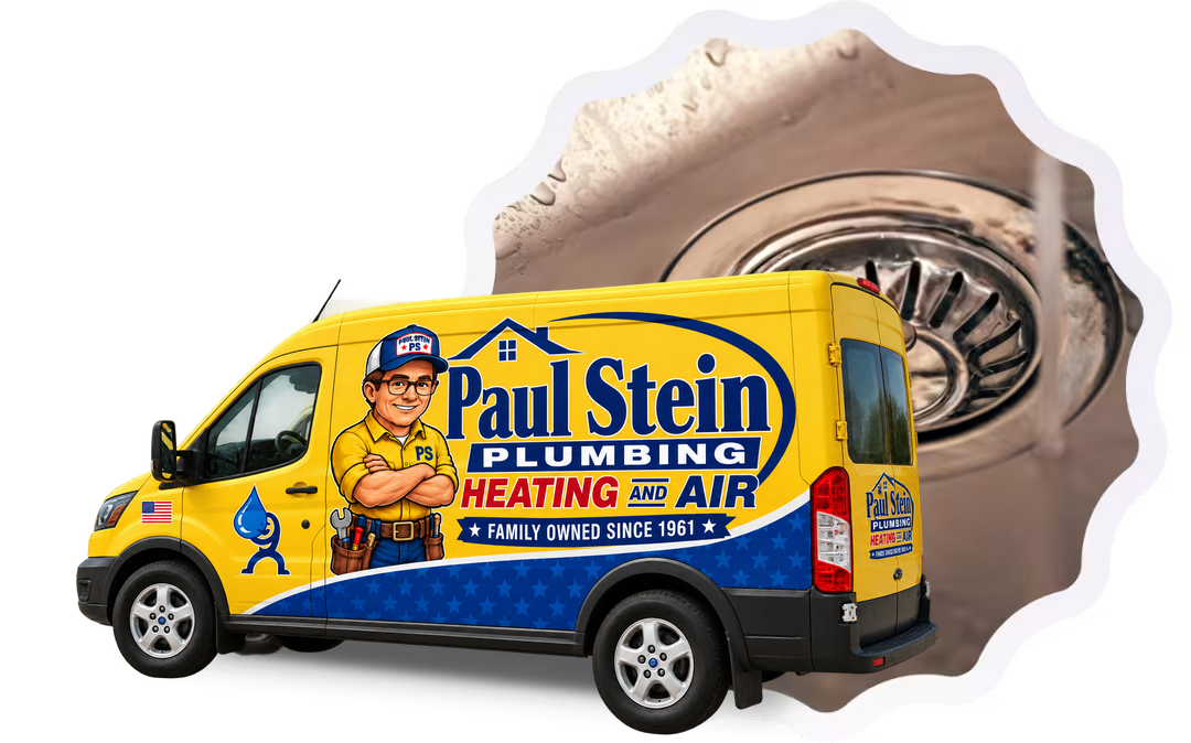 Paul Stein Plumbing van with a plumber's tools and equipment in the background.